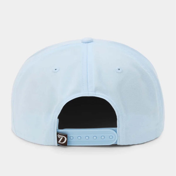 Back view of Duck Camp Icewater blue cap featuring adjustable blue snapback closure and brown woven logo tag.