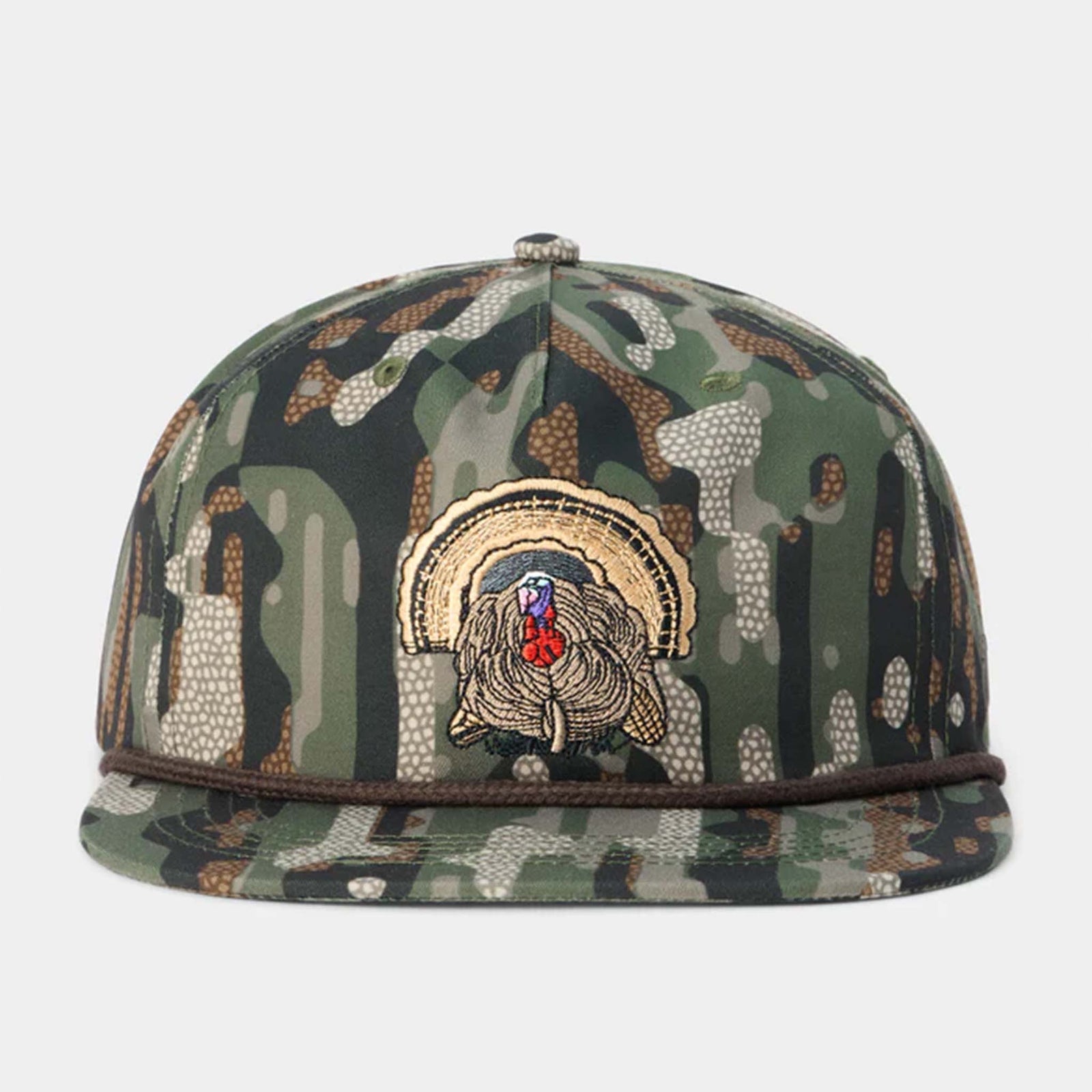 Camouflage cap with a turkey patch on a white background
