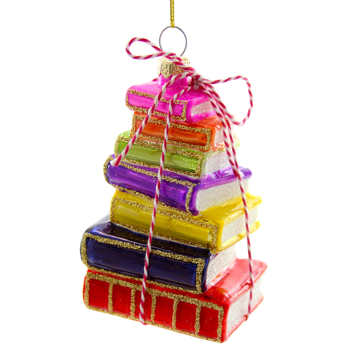 Colorful ornament of stacked books with glitter details and a red and white striped bow on top.
