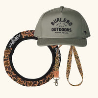Graphic collage image of a Burlebo hat, Local Boy steering wheel cover and camoflauge lanyard.