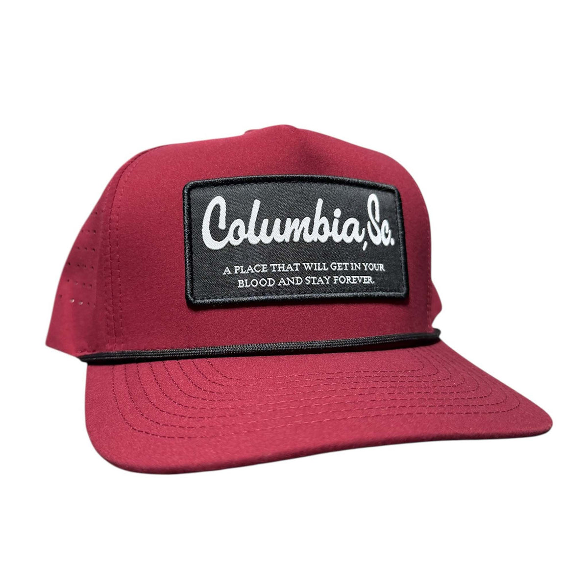 Red cap with a black patch featuring 'Columbia, SC' on a white background