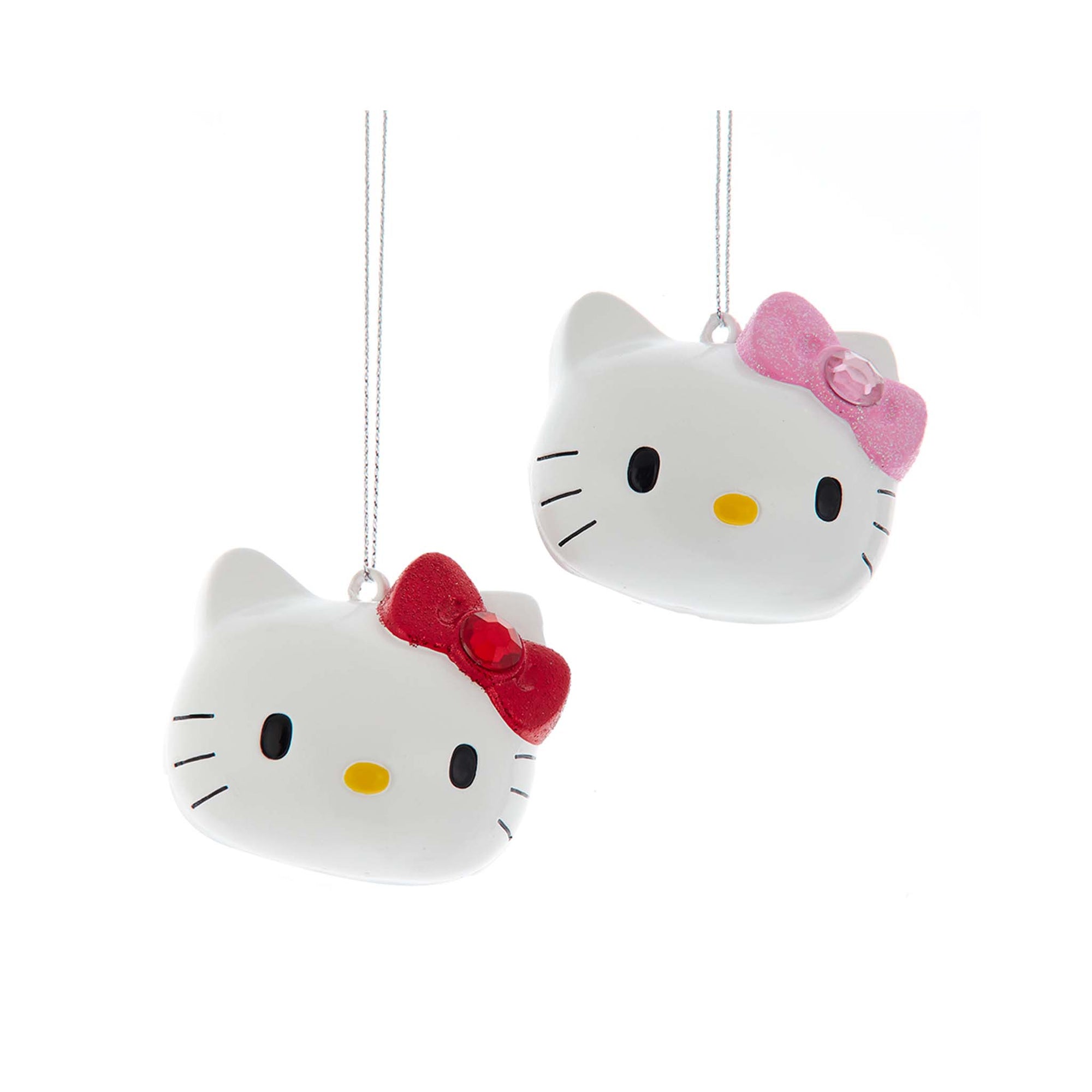 Assorted Hello Kitty head ornaments with pink and red bows.