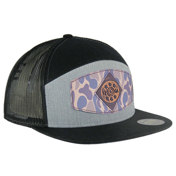 Richardson 168 7 panel black trucker hat with a black mesh backing. The hat features 7 panels, a flat bill, a burnished patch on the front and an adjustable snapback.
