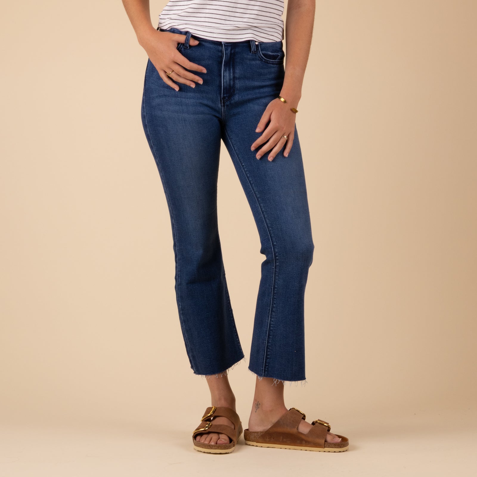 Woman Wearing Just Black Denim Tonal crop flare jeans in dark wash. Sizes 24, 25, 26, 27, 28, 29, 30, 31.
Just Black Denim tonal crop flare jeans in dark denim, featuring a high-rise waist, cropped flared legs, and matching dark stitching for a sleek, monochromatic look