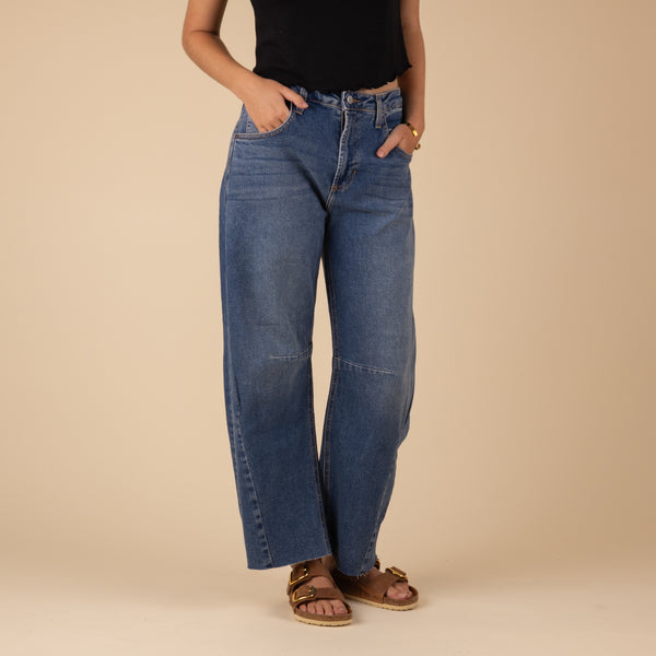 Just Black Seamed Barrel Jeans in Medium Wash, sizes 24, 25, 26, 27, 28, 29, 30, and 31, 100% cotton. 
These stretch Barrel wide-leg jeans bring major chill vibes to your look. With a vintage look, the relaxed fit shows it's all about comfort and style, they're your go-to for nailing that effortless cool. Features: Rise: 12”and Inseam: 27”, 96% Cotton, 3% Elasterell-P, 1% Spandex, made in USA, machine wash cold, lay flat to dry recommended.