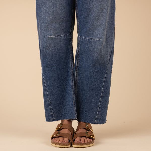 Just Black Seamed Barrel Jeans in Medium Wash, sizes 24, 25, 26, 27, 28, 29, 30, and 31, 100% cotton. 
These stretch Barrel wide-leg jeans bring major chill vibes to your look. With a vintage look, the relaxed fit shows it's all about comfort and style, they're your go-to for nailing that effortless cool. Features: Rise: 12”and Inseam: 27”, 96% Cotton, 3% Elasterell-P, 1% Spandex, made in USA, machine wash cold, lay flat to dry recommended.