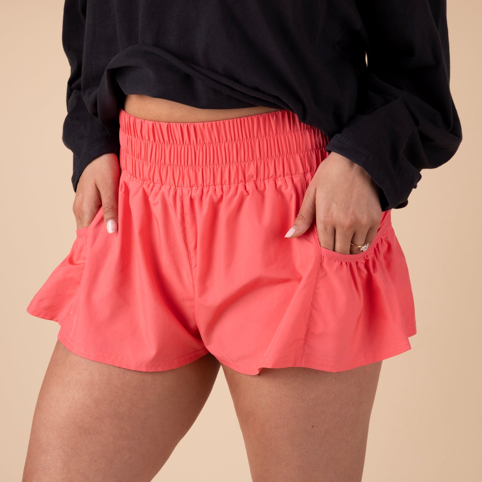 Free People Movement Athletic Shorts in Hibiscus – lightweight workout shorts with an elastic waistband and side pockets
