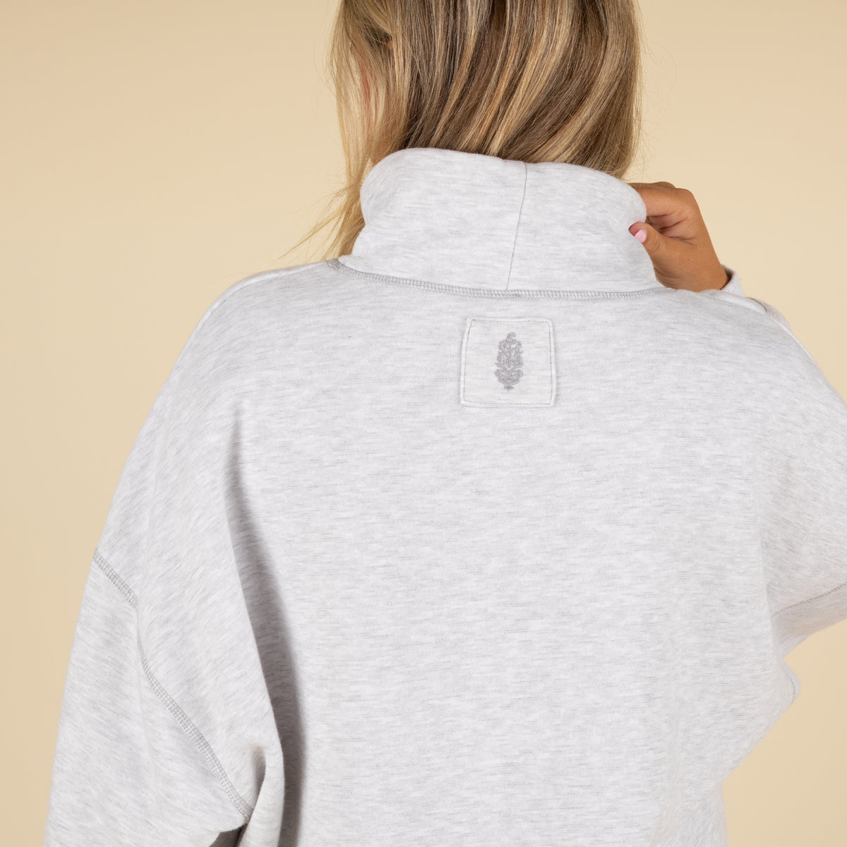 Detail shot of the back of a FP Movement sweatshirt.