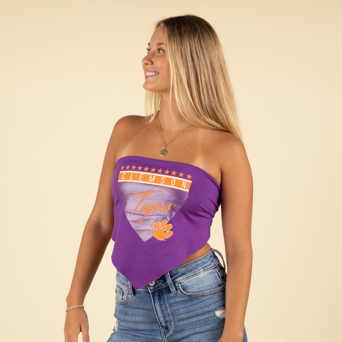 Side profile of the model wearing the Clemson Tigers purple tube top, showing relaxed fit and handkerchief hem.