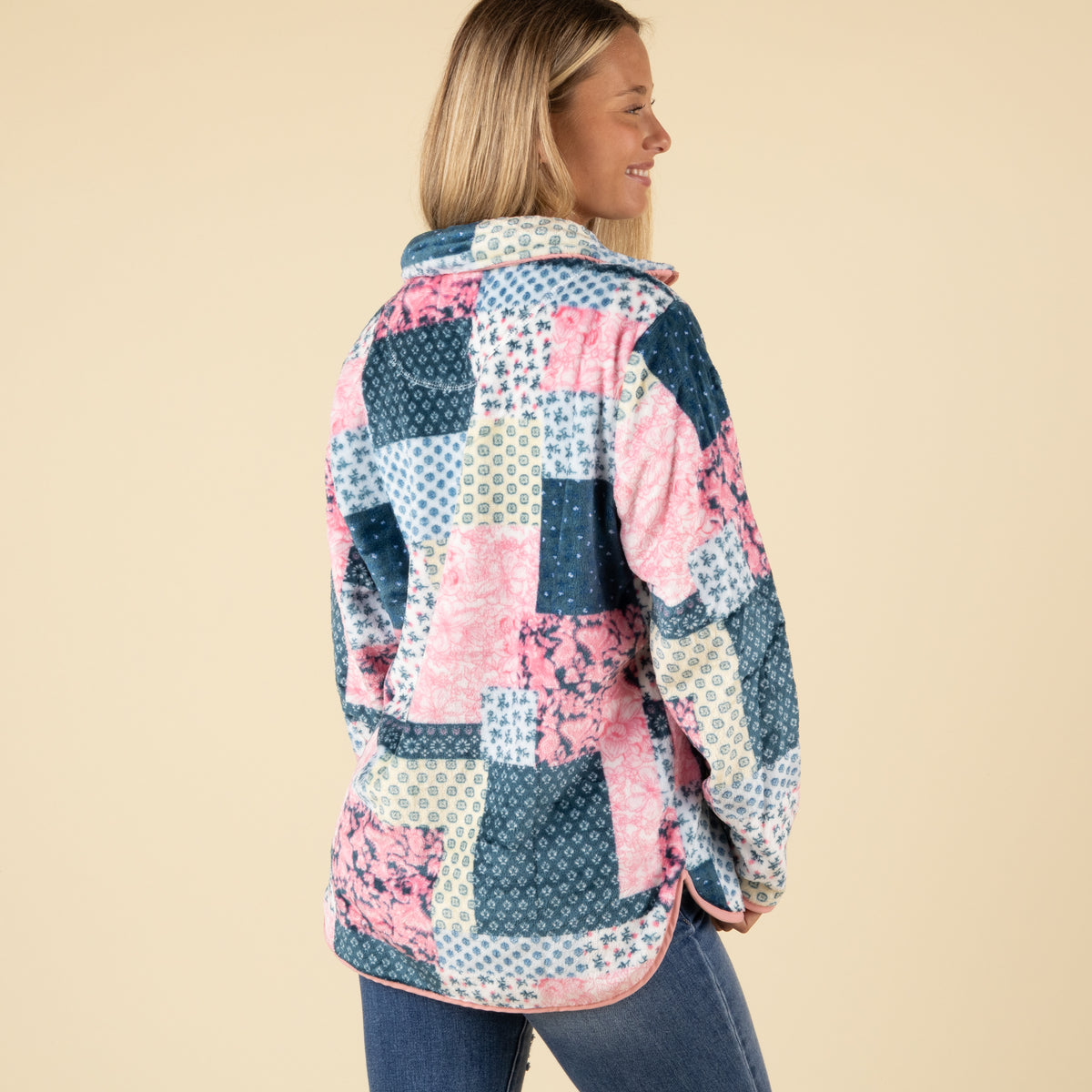 Back view of Simply Southern patchwork fleece pullover with colorful pink, blue, and cream square patterns.