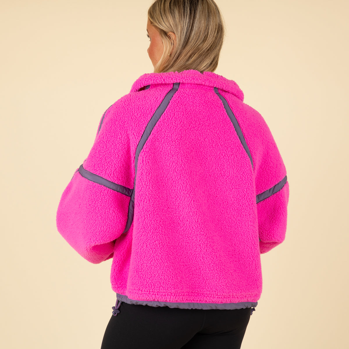 Model wearing FP Movement Mountain High Half Zip Pullover in Fuchsia