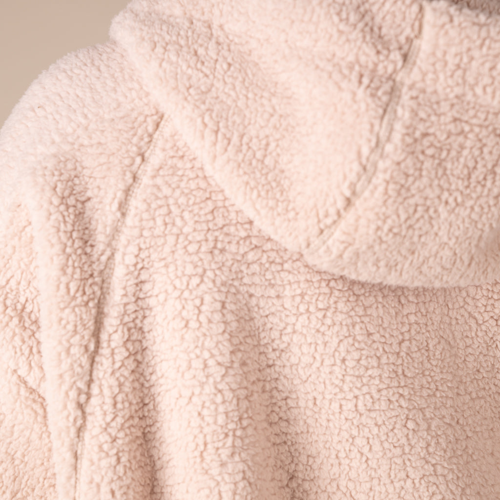 Close-up of a textured beige fabric surface