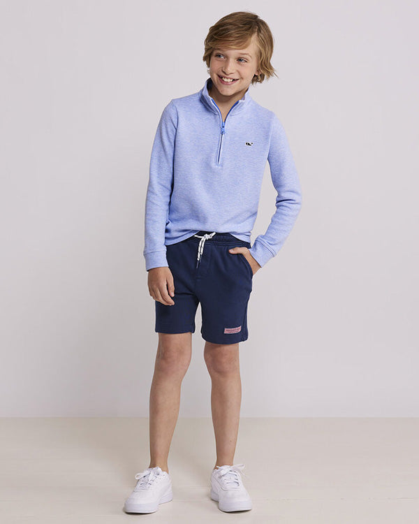 boy posing for the camera in a vineyard vines studio photoshoot