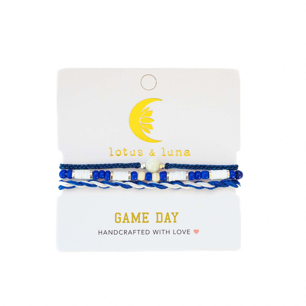 Lotus & Luna Game Day bracelet set with blue and white beads, pearl accent, and twisted string, displayed on packaging.