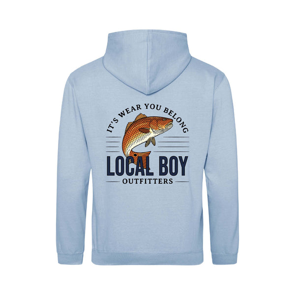 Local Boy Outfitters youth light blue hoodie with back graphic of a redfish, bold “Local Boy Outfitters” text, and slogan “It’s Wear You Belong.”