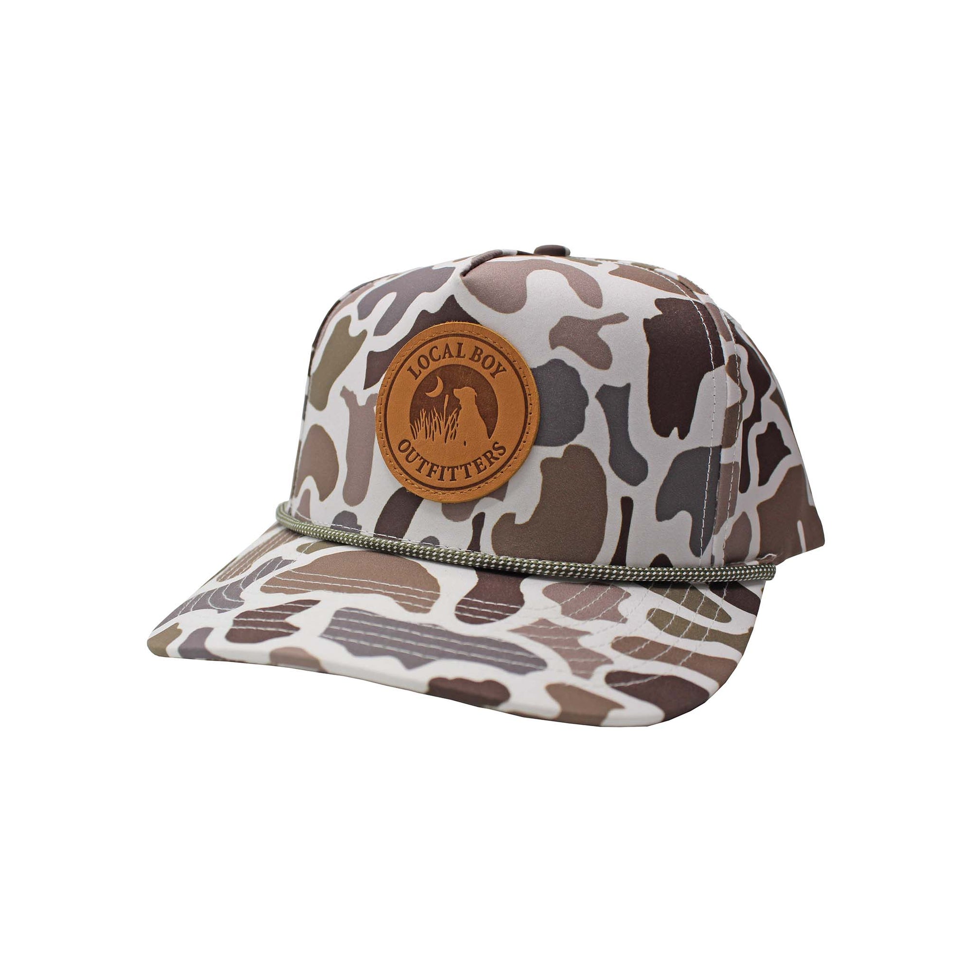 Youth camo snapback hat with leather Local Boy Outfitters patch and rope detail across the brim.