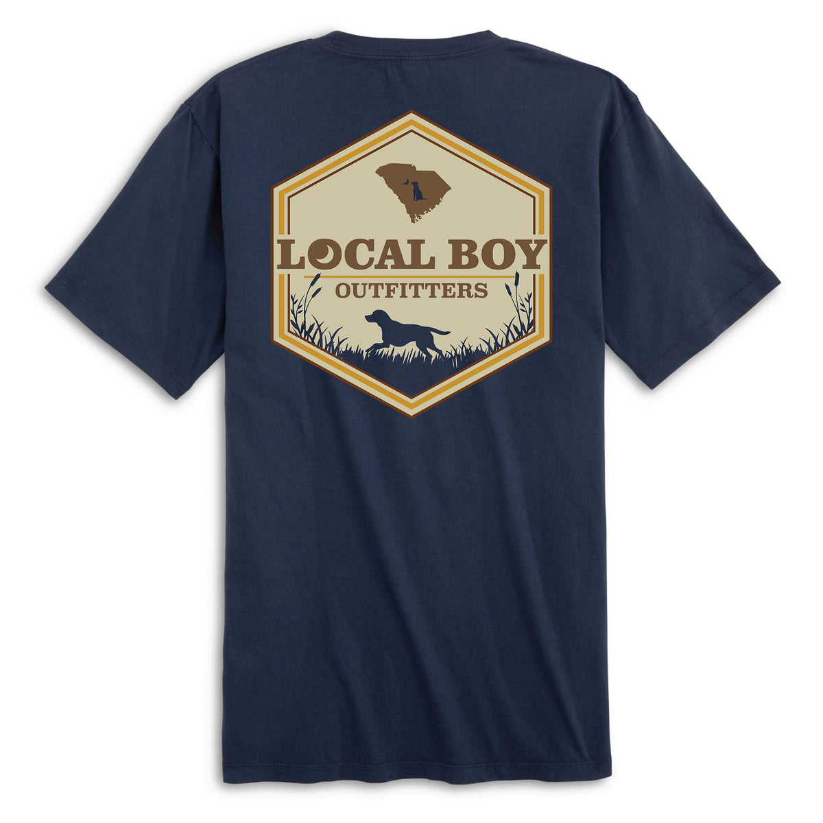 Back view of navy short sleeve t-shirt with large hexagon-shaped graphic featuring a brown silhouette of South Carolina, “Local Boy Outfitters” text, and a black silhouette of a dog standing in grass with cattails.
