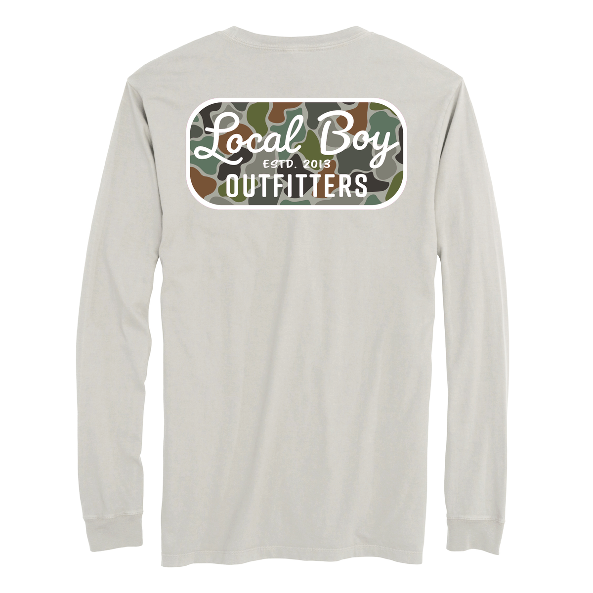 Local Boy Outfitters long sleeve t-shirt in light silver featuring a back graphic with white “Local Boy Outfitters” text over a green, brown, and tan camouflage background with “ESTD. 2013” centered in the design.