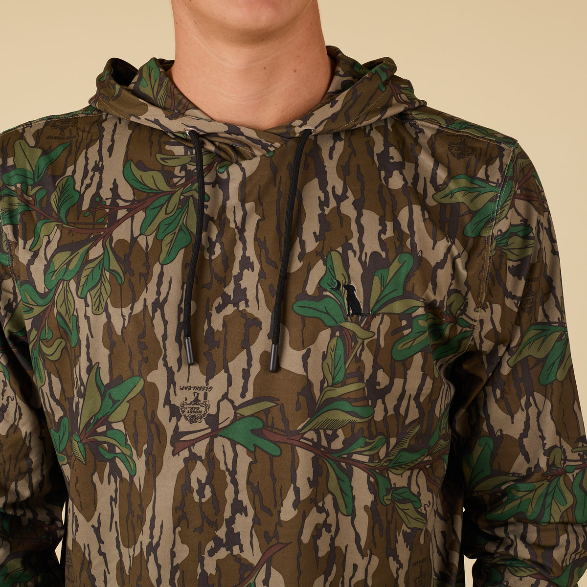 Close up detail shot of drawstrings and Local Boy Outfitters dog and moon logo.