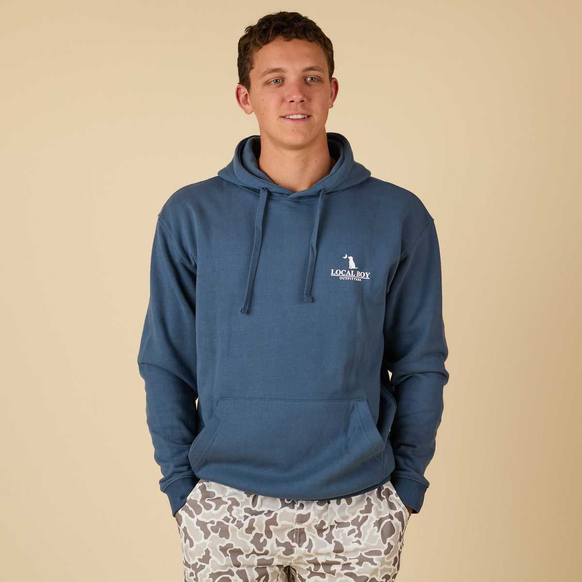 Front of man wearing a blue Local Boy hoodie.
