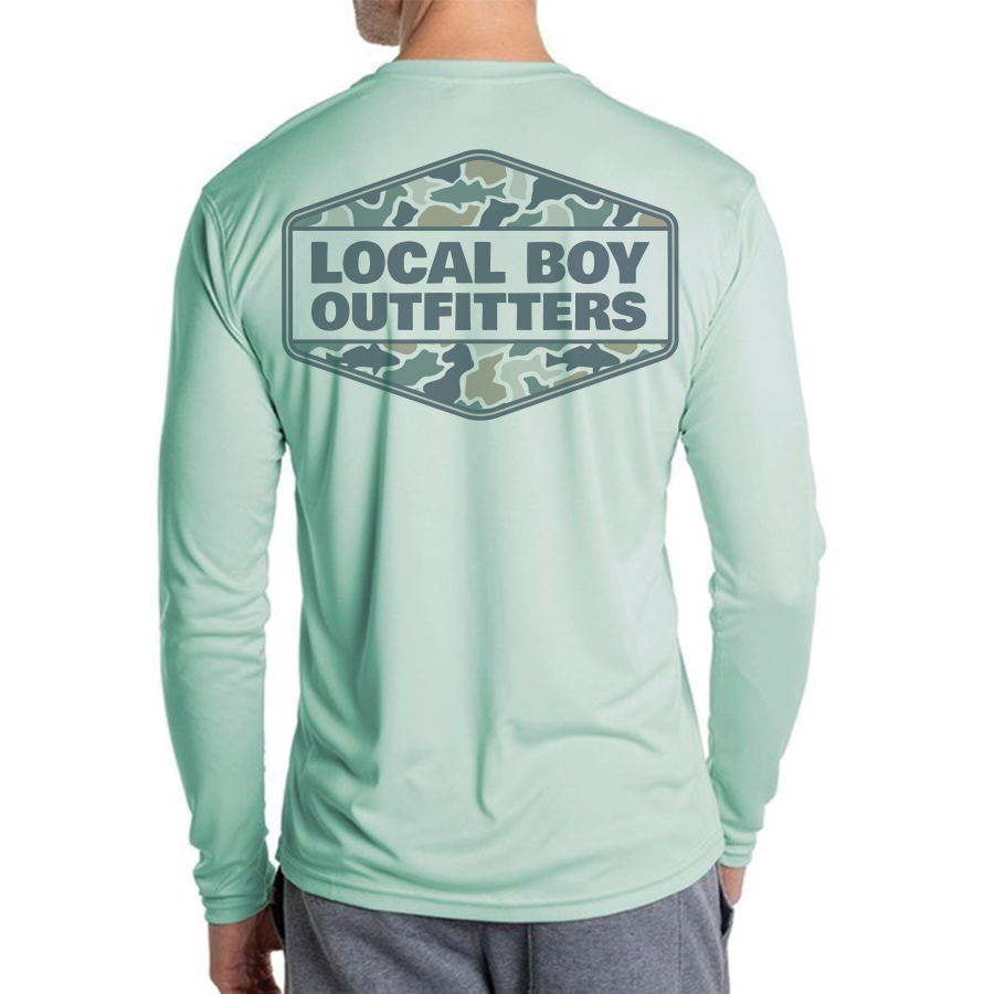 Aqua Long-sleeve shirt with camo badge and Local Boy Outfitters branding shown on a white background.