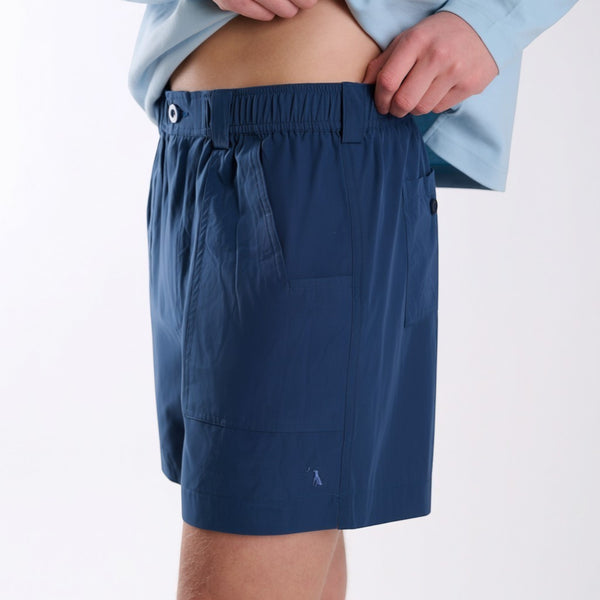 Front angled view of navy fishing shorts.