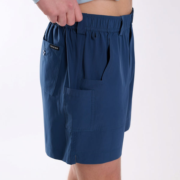 Angled side view of navy fishing shorts.
