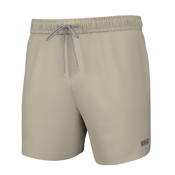Beige Local Boy swim trunks with an elastic waistband and a drawstring closure.
