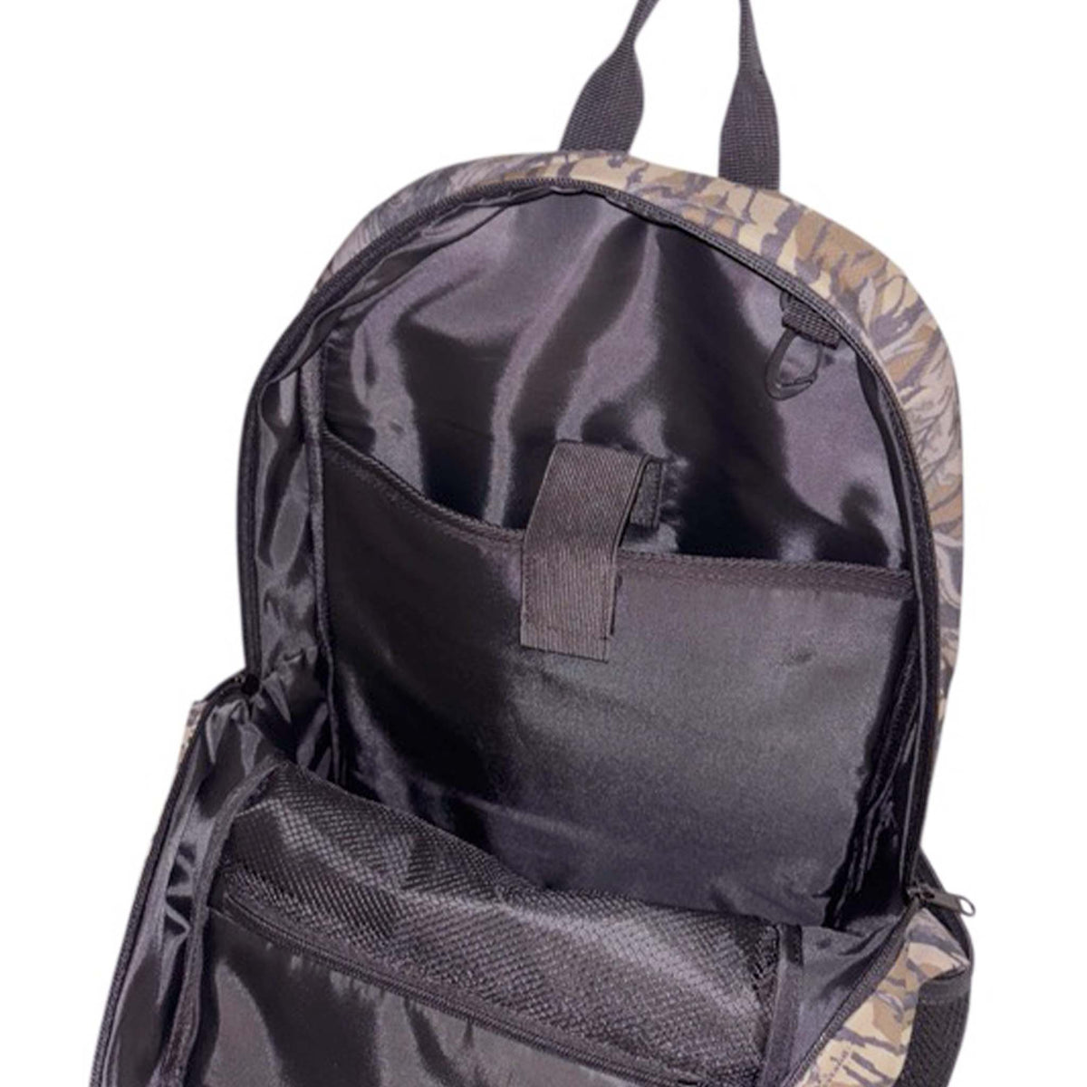 Open interior view of the Treestand camo backpack showing the padded laptop sleeve and mesh zip compartment.