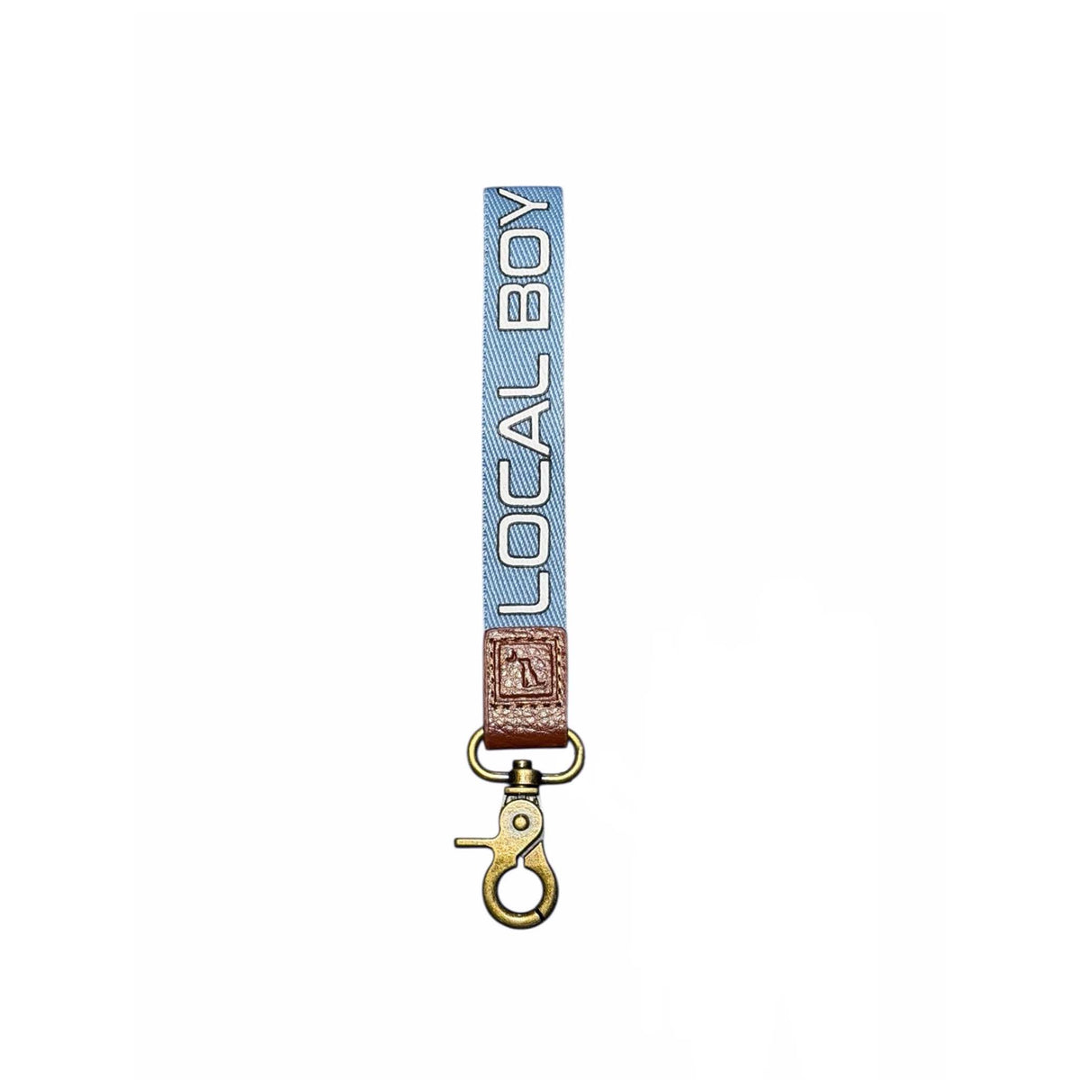 Wrist lanyard 'LOCAL BOY' branding on light blue fabric shown on a white background