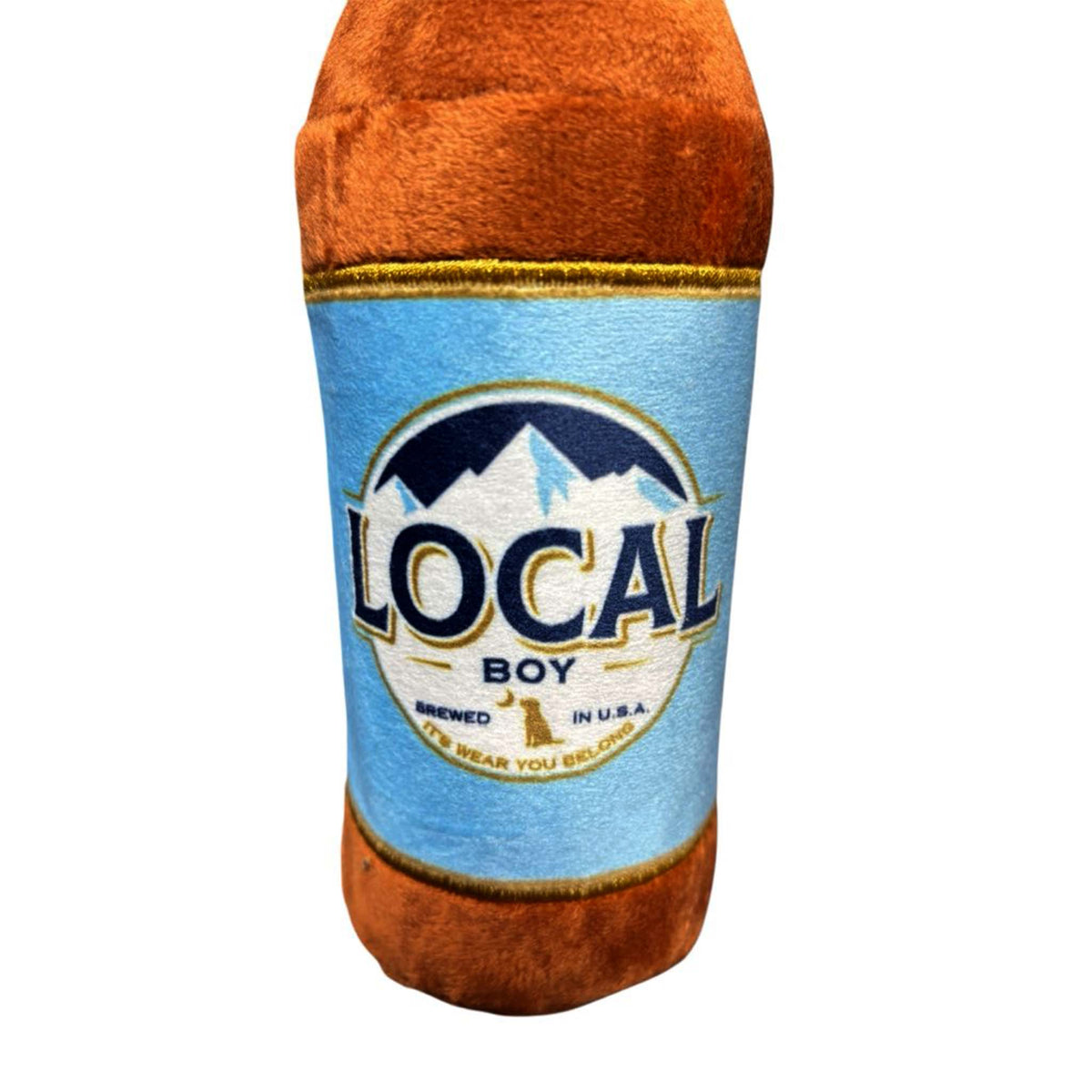 Brown plush toy shaped like a beer bottle with a blue “Local Boy” label and mountain logo on front.