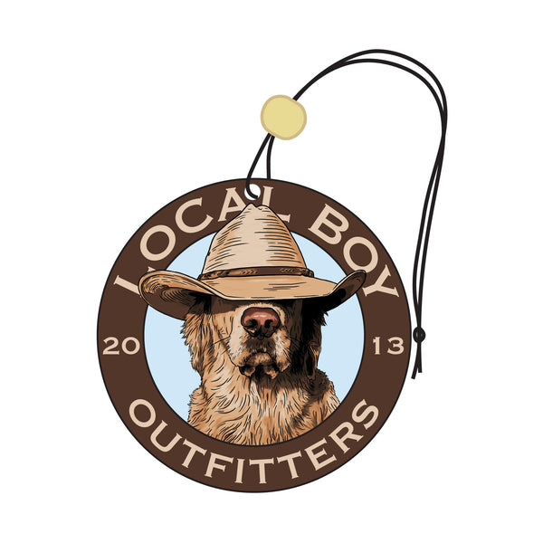 local boy outfitters brown air freshener with a lab in the middle wearing a cowboy hat.  Ready to hang with a string.
