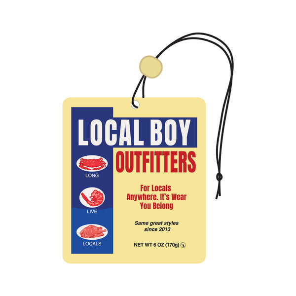 Yellow and blue 'Local Boy Outfitters' air freshener with branding and text on a white background