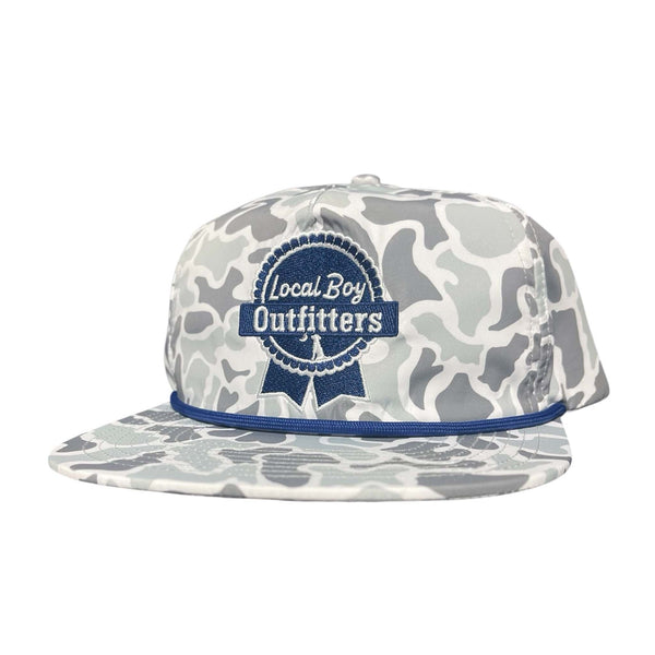 White and grey camo hat with blue embroidered Local Boy Outfitters ribbon logo and blue rope detail across the brim.