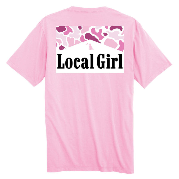 Local Girl Outfitters short sleeve t-shirt, color blossom pink, sizes S-XXL, 100% cotton. Back has a roofline silhouette with pink camo pattern and black “Local Girl” text.