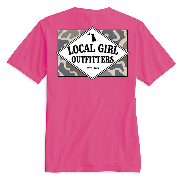 Local Girl Outfitters short sleeve t-shirt, color crunchberry pink, sizes S-XXL, 100% cotton. Back features diamond logo with black text, dog and moon icons over a gray camo background.