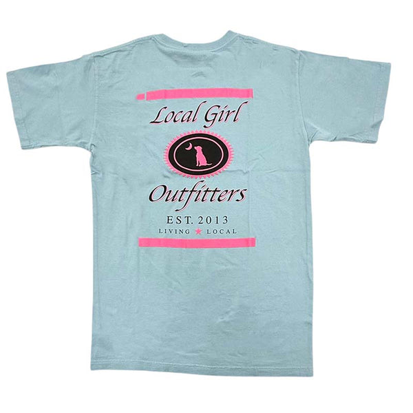  Local Girl Outfitters short sleeve t-shirt, color chambray, sizes S-XXL, 100% cotton. Back features pink and black crest with dog and moon, “Living Local” and “Est. 2013” text.