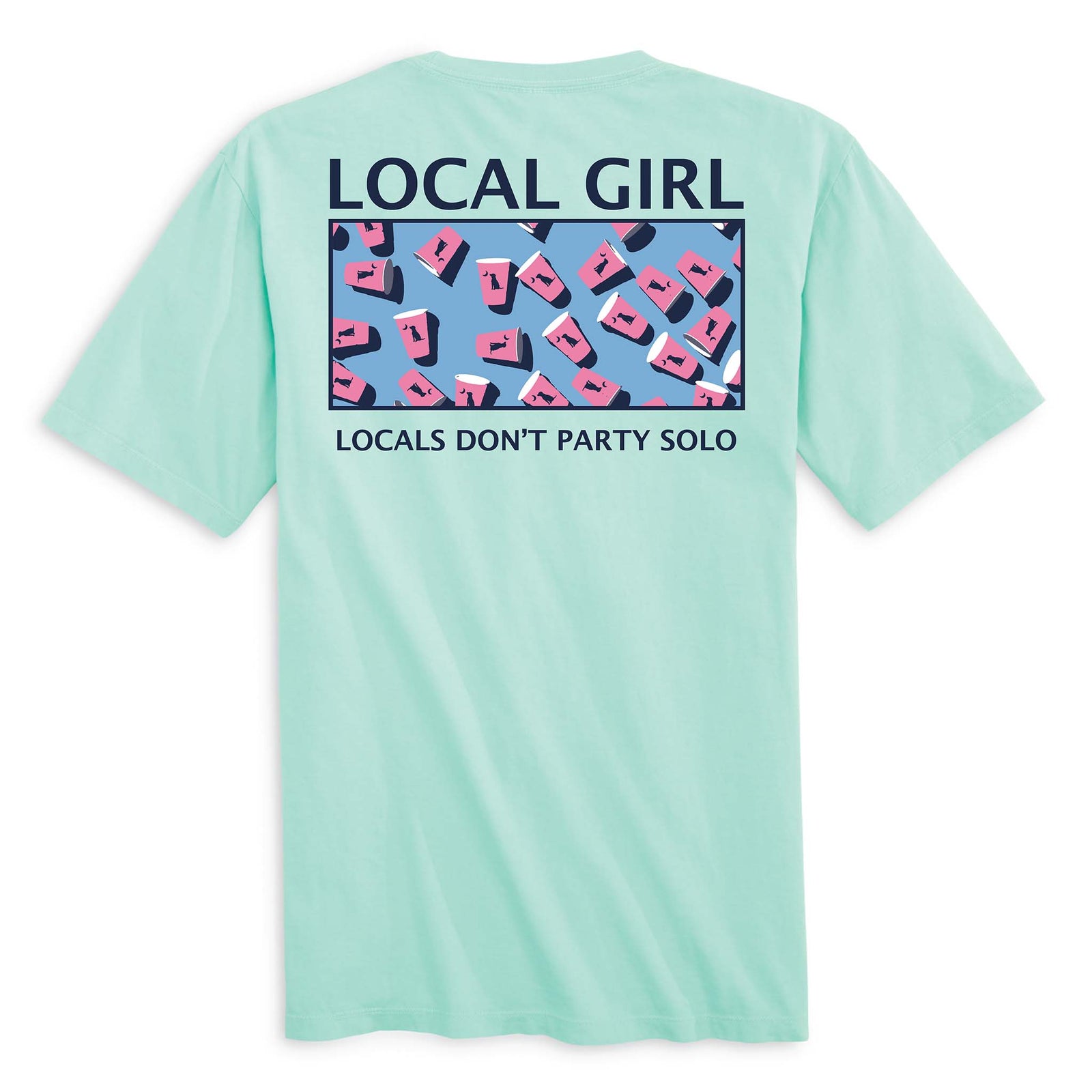 Back view of a mint green t-shirt featuring a graphic of scattered pink and white solo cups with dog silhouettes, set against a blue background. The text "LOCAL GIRL" appears above the design, and below it reads "LOCALS DON’T PARTY SOLO" in bold capital letters.