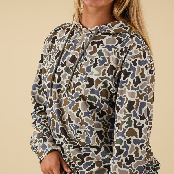 lose-up of front chest and hood details on camo print performance hoodie.