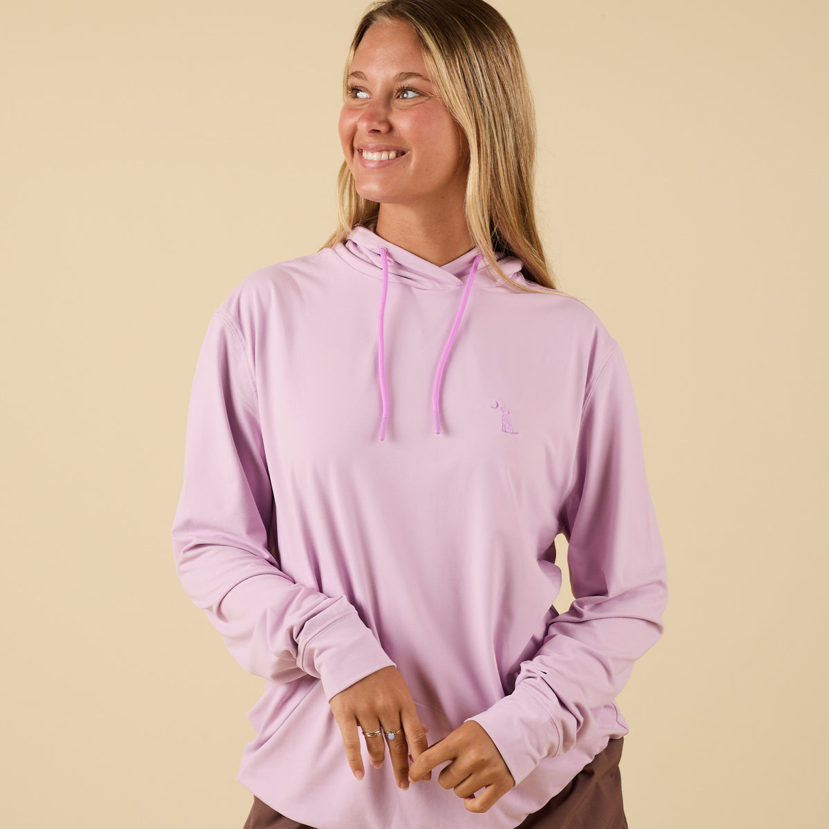 Front view of Orchid performance hoodie with drawstrings and embroidered dog logo.