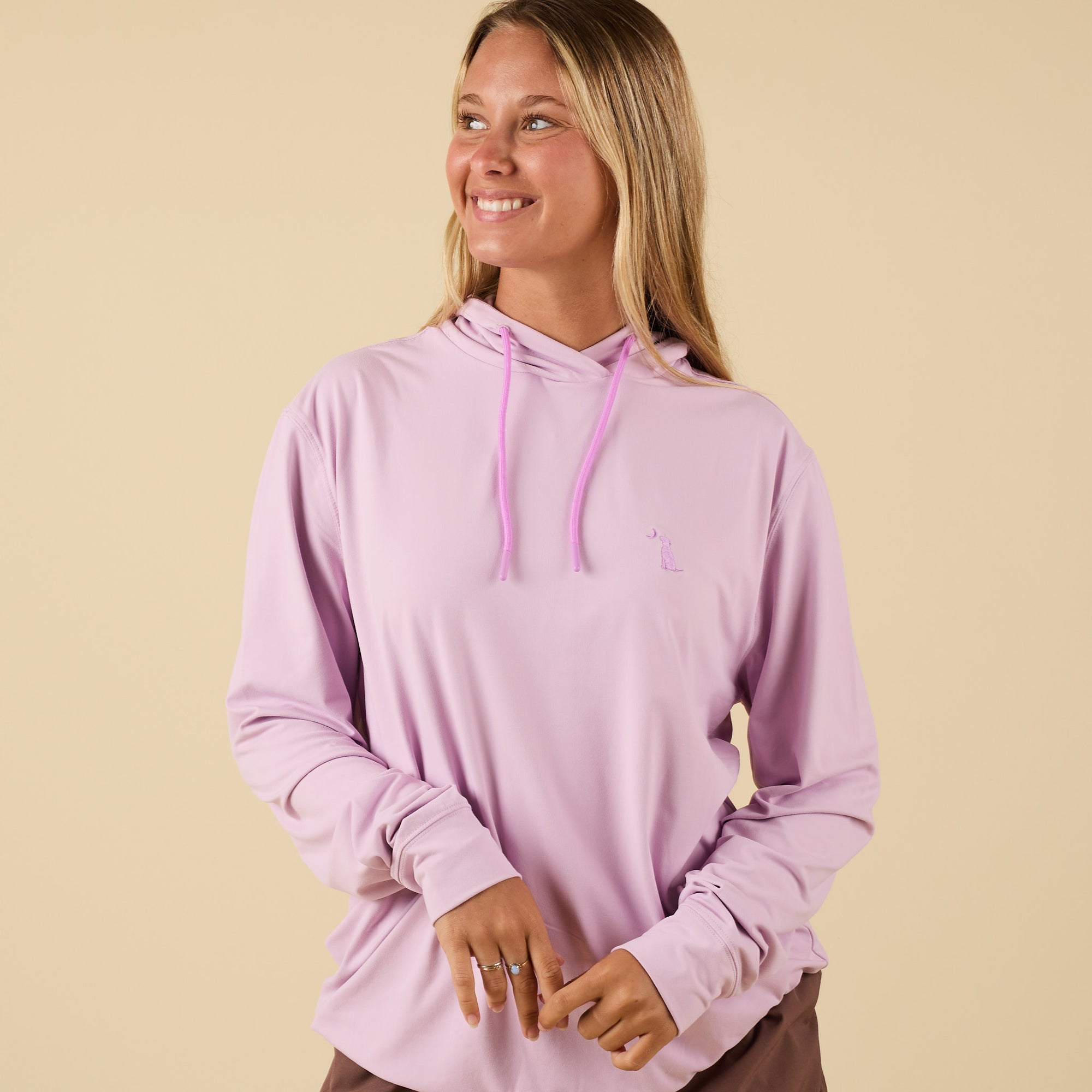 Front view of Orchid performance hoodie with drawstrings and embroidered dog logo.