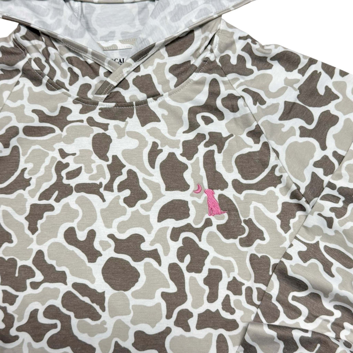 Close up of logo on left chest of Local Girl Outfitters long sleeve hooded t-shirt in tan and brown camo pattern.