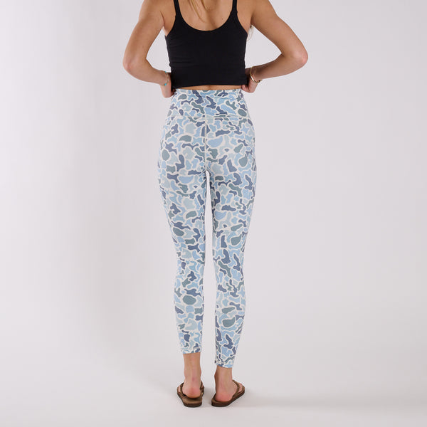 Back view of high-waisted blue camo leggings showing full-length fit and seam detailing.