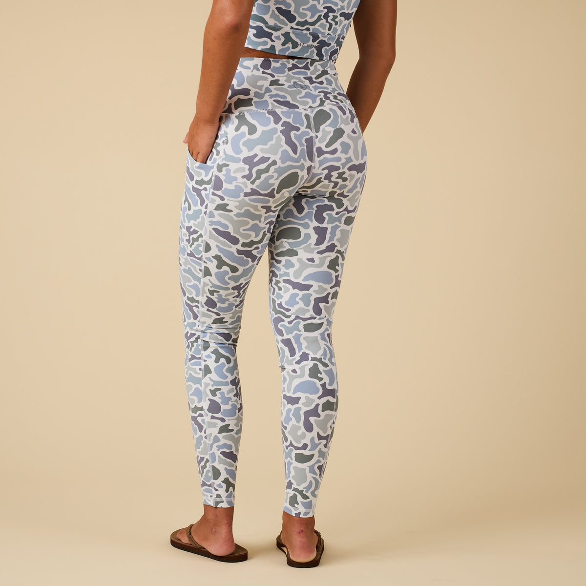 Local Girl high-waisted camo print leggings, shown from the back on model with matching crop top.