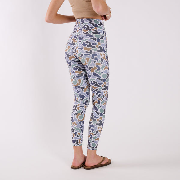 Side back view of camo leggings highlighting contoured seams and fitted silhouette.