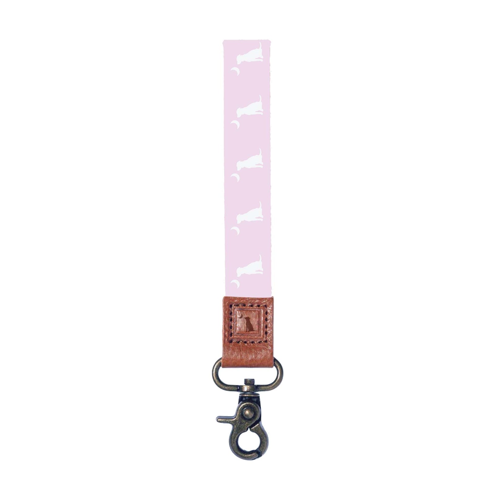 Pink Local Girl Outfitters keychain with repeating white dog and crescent moon pattern, leather stitched accent, and metal lobster clasp.