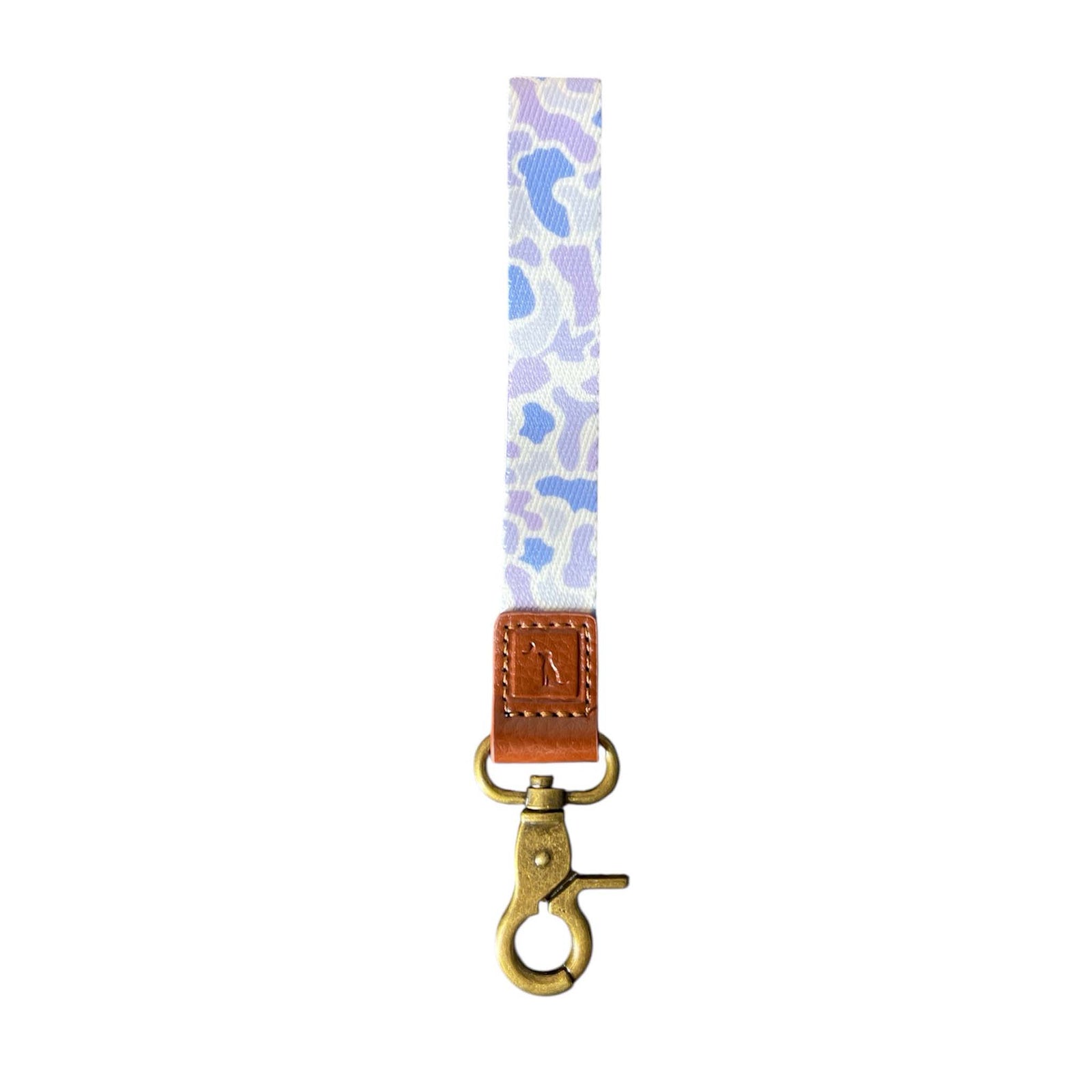 Local Girl Outfitters wristlet keychain in purple and white camo with brown faux leather trim and brass swivel clasp.