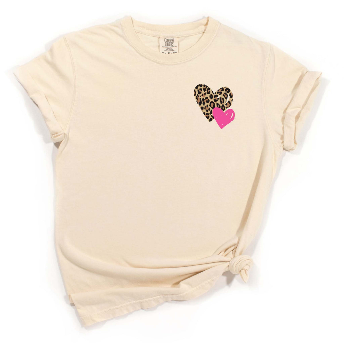 Ivory short sleeve tee with leopard and pink heart graphic on the left chest.