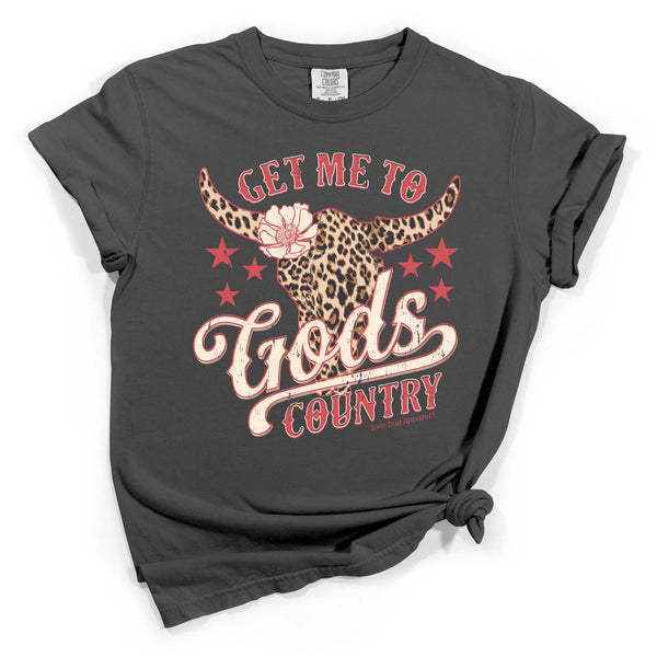 Dark gray short sleeve t-shirt with red and cream text reading “Get Me to God’s Country” and a leopard print longhorn graphic with stars.