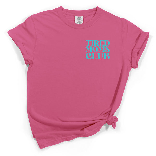 Front view Pink t-shirt with 'TIRED MOMS CLUB' text on a white background